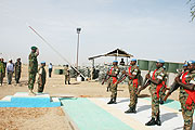Gen Kabarebe takes the salut in Darfur yesterday. (Photo RDF)