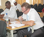 CHANGING LANES: Applicants taking Rwandan citizenship examinations recently.(File photo)