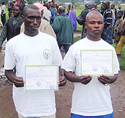 Ex-combatants display their certificates at Mutobo Demobilisation Centre last week. (Photo / G. Mugabe)