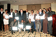 The computer programmers holding certificates, pose for a photo with their mentors, key players in ICT, World Health Organisation and the Ministry of Health