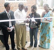 UNHCR associate field officer Mary Cisse (2nd left) cuts a tape to commission the health facility in the company of other local leaders (Photo S Nkurunziza