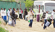 Lining up for scarce transport; Students board an ONATRACOM bus yesterday. (Photo: S. Nkurunziza)