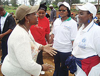 Foreign affairs Minister Rosemary Museminali chats with other government officilals shortly after Umuganda on Saturday