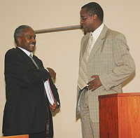 Education Minister Charles Murigande shares a light moment with Senate President Vincent Biruta during the formeru2019s appearance before senate last week.
