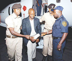 One of the convicts from the UN Special Court for Sierra Leone being handed over to Rwandan Prison security officers upon arrival at Kigali International Airport. (Courtsey Photo)