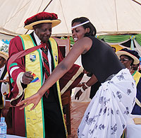 Prof. George Kanyeihamba joins a Rwandan traditional dancer during the graduation ceremony. (Photo/ B. Asiimwe)