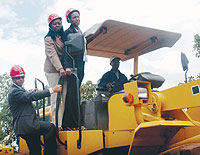 Infrastructure Minister, Linda Bihire, Kigali City Mayor, Aisa Kirabo and China Road General Manager Li Jianbo aboard a bulldozer at the commissioning of the Kanombe road construction. (Photo J Mbanda)
