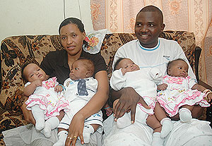 Jeanne du2019Arc Mukamana and her husband cuddle their quadruplets yesterday. (Photo/ J. Mbanda)
