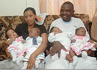 Jeanne du2019Arc Mukamana and her husband cuddle their quadruplets