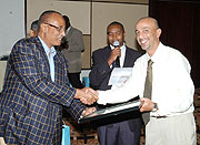 Talib A. Taib the MD of Pembe Flour (right) receiving his accolade from Shukiri Baramadi the Chariman of Kenya Ports Authority