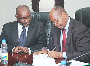 L-R: Social Security Fund Director General, Henry Gaperi, and Finance Minister, James Musoni, signing a Performance Contract on Friday.(Photo/ F Goodman)