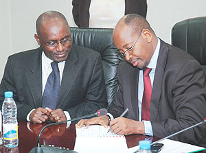 L-R: Social Security Fund Director General, Henry Gaperi, and Finance Minister, James Musoni, signing a Performance Contract on Friday.(Photo/ F Goodman)