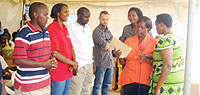 District officials handing over prizes to outstanding women cooperatives in Kamonyi.(Photo / D. Sabiiti)