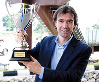 Alexander Koch displaying the trophy.
