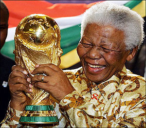 Former South African president, Nelson Mandela holding the Fifa World Cup. Rwandans shall be given the same oppertunity