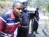 Kamonyi Mayor, Jacques Rutsinga, tries out one of the new speed governors that has been deployed to curb accidents along the Butare-Kigali highway. (Photo/ D. Sabiiti)
