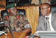 Brig.Gen. Gasana and Minister Gatare, chat in Parliament before their swearing-in. (Photo/ J. Mbanda)
