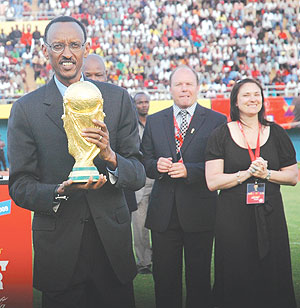 President Paul Kagame holding the World Cup Trophy at Amahoro Stadium yesterday. (Photo/ J. Mbanda)