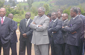 Dr Charles Karemangingo, Left, accmpanied by Dr Murigande with the visiting deligation visit ISAE farm. (Photo/ B Mukombozi