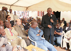Rwandair CEO Amb. Gerald Zirimwabagabo addressing mourners at the funeral of Mrs Azela Nyirangororo who died at King Faycal Hospital following Rwandair plane crash at Kigali International Airport.