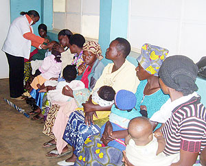 A Nurse vaccinates children against Polio at Byumba health center on Tuesday. Photo/A.Gahene)