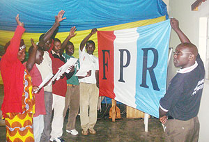 Samuel Hatangimana (R), the Atraco RPF special cell chairman  administers an  oath to the new members. 