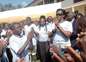 First Lady Jeannette Kagame (R) joins the youth in a song at College St. Andru00e9 yesterday. (Photo J Mbanda)