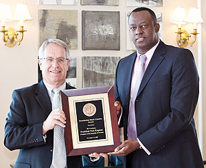 Ambassador Eugene Gasana (R) receiving the award on behalf of President Kagame at Utah State University (Courtsey Photo)