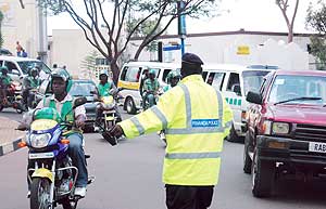 A Police man directs traffic during the Road safety week that preceded Christmas. (File photo)