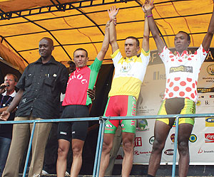 WINNERS:  Adil Jelloul (C), Saadoune Abdelaati (L) and Adrien Niyonshuti (R) pose for a photo with Sports and Culture minister Joseph Habineza. Photo / 