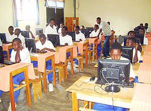 Students try out the new Computers at Kiziba Refugee camp on Tuesday (Photo: S. Nkurunziza)