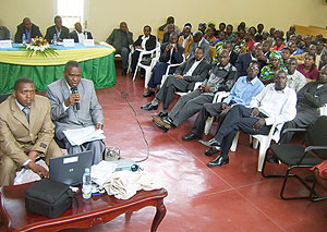 Gicumbi Intermediary Court vice president Fu00e9licien Nsengiyumva (with Mic) presents the Courtsu2019 achievements. (Photo: A. Gahene)