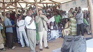 Emmanuel Santos, the head of UNHCR Kibuye addressing the marchers at Kiziba refugee camp (Photo: S. Nkurunziza)