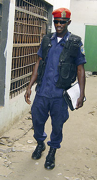 A Liberian police officer outside jail cells. Photo credit: UN /  Margaret Novicki