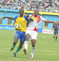 Yusuf Ndayishimiye (L) takes on a Malian player during the 2010 Africa Youth Championship. The midfielderu2019s height and sleek passing will be crucial for Amavubi at the Orange Challenge Cup which kicks off today.
