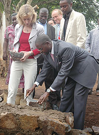 State Minister Mathias Harebamungu and DfIDu2019 Regional Chief Joy Hutcheon laying a foundation stone at the Butamwa school (Photo F Goodman)