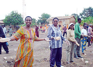Work Hard-Senator Aloysia Inyumba leads by example to construct schools blocks in Muhanga. (File photo)