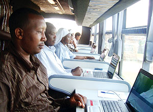 Gisagara Mayor Leandre Karekezi u2018surfingu2019 on the ICT BUS. (Photo/ F. Ntaweukuriryayo)