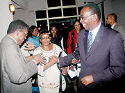 Prime Minister Bernard Makuza shares a light moment  with MPs after the session. (Photo J Mbanda)
