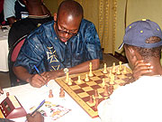 Abiye (R) playing against a Uganda player.