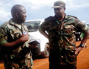 Lt. Col Paul Semana (R) listening to Capt. Denis Rwamo during a visit to the Dyke. (Photo/ E. Mutara )