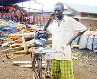 A resident selling firewood in Rwamagana market. 