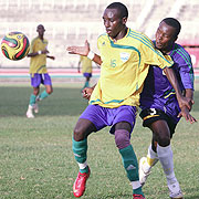 Amavubiu2019s winger Tumaine Ntamuhanga shields off Tanzaniau2019s Juma Jabu in yesterdayu2019s second semi-final clash. Rwanda came off 2-1 winners to set up a finalu2019s clash with Uganda. (Photo: Cecafa)