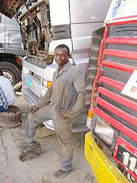 Baptiste Hakizimana stands next to his livelihood source