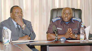 Central bank governor, Franu00e7ois Kanimba(L) and  Commissioner General of Police, Emmanuel Gasana, explains u2018Bank Rambertu2019 issue to the Media after arrest of culprits   Wednesday ( Photo : Goodman )
