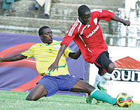 Amavubiu2019s Amman Uwimana tackles Ugandau2019s Robert Sentogo in yesterdayu2019s Orange Cecafa Challenge Cup final. Uganda came off 2-0 winners. (Photo/Cecafa)