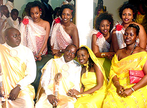 Miss Tonzi and her fiancu00e9 Alfred Gatarayiha (centre) look wonderful with the maids.