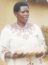 Grace Mukasine posing with a tray of eggs. (Photo: D. Ngabonziza)