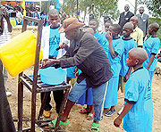 Residents and school children washing their hands using water soap. A personal and domestic hygiene campaign that commenced yesterday