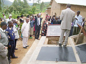 An official of Rwanda environment care explains how ecological toilets work during the launching ceremony at Karambo B primary School on Thursday. (Photo: A. Gahene)